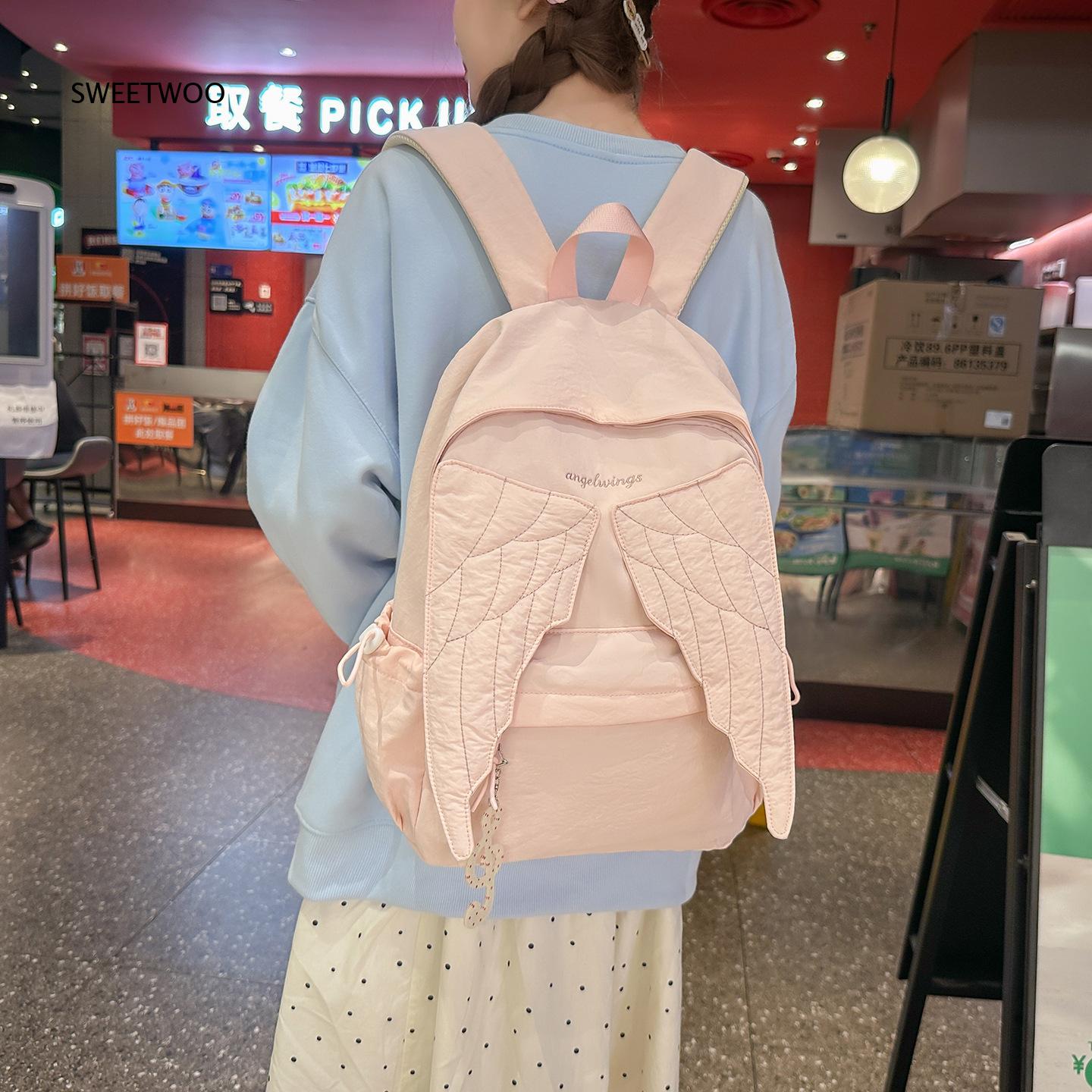 Embroidery And Quilting - กระเป๋าเป้สะพายหลังผู้หญิงสีชมพูปีกนางฟ้า ปักลายปีกนก น้ำหนักเบา ทำจากไนลอน เหมาะสำหรับใช้ในชีวิตประจำวัน ไปโรงเรียน